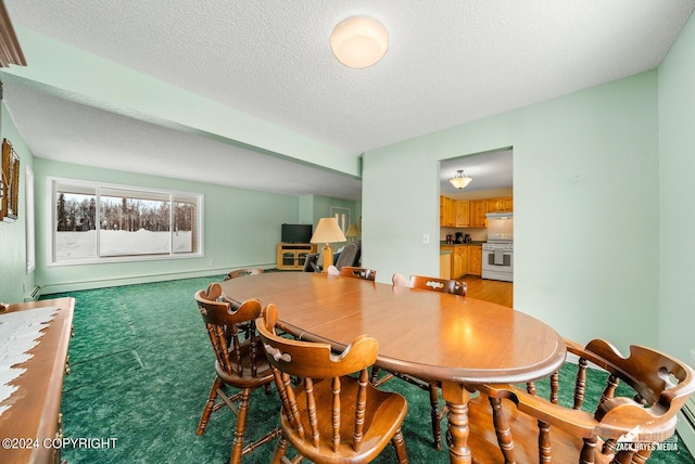 dining space featuring dark carpet and a textured ceiling