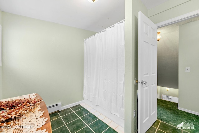 bathroom with tile flooring and a baseboard radiator