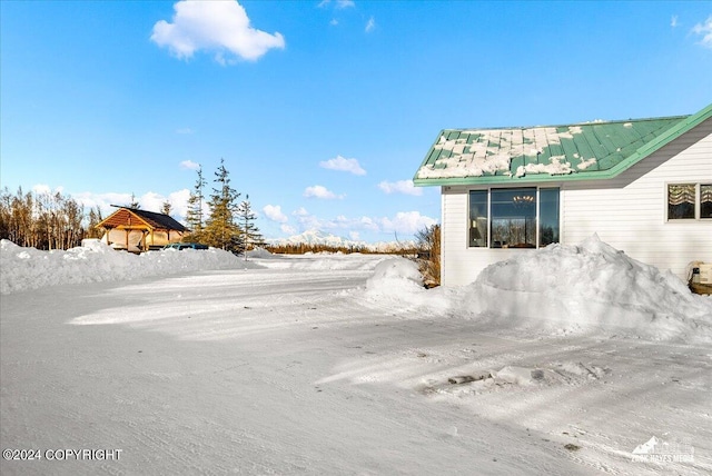 view of yard covered in snow