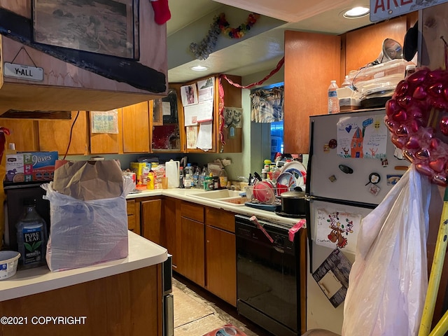 kitchen featuring refrigerator, dishwasher, sink, and light tile flooring