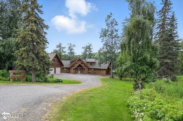33405 Keystone Dr, Soldotna, AK 99669 - view of front facade with a garage, a front yard, and gravel driveway