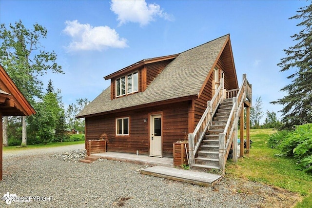 33405 Keystone Dr, Soldotna, AK 99669 - view of front facade featuring roof with shingles and stairway