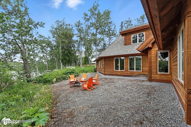 33405 Keystone Dr, Soldotna, AK 99669 - view of yard featuring an outdoor fire pit