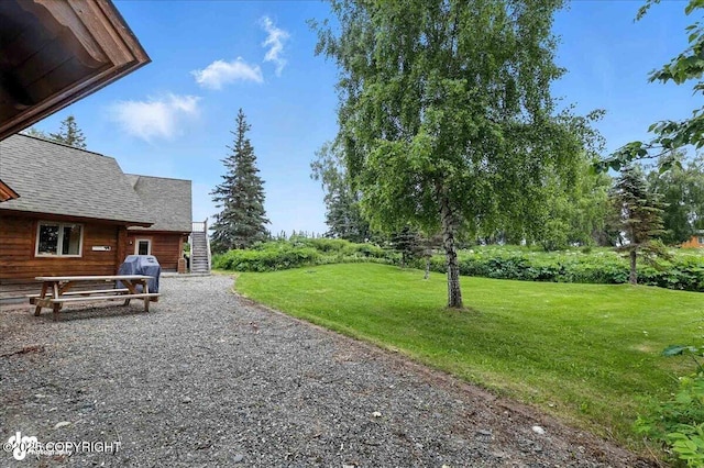33405 Keystone Dr, Soldotna, AK 99669 - view of grassy yard with stairs
