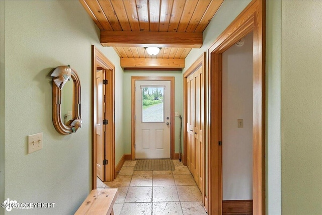 33405 Keystone Dr, Soldotna, AK 99669 - doorway to outside featuring baseboards and a wooden ceiling with exposed beams