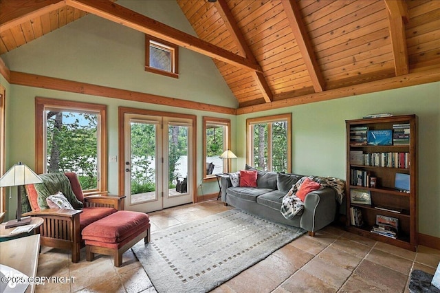 33405 Keystone Dr, Soldotna, AK 99669 - living area with stone tile flooring, a wood ceiling with exposed beams, and high vaulted ceiling