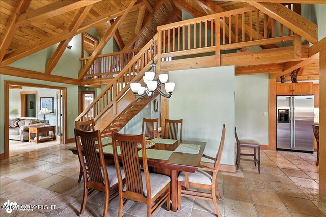 33405 Keystone Dr, Soldotna, AK 99669 - dining area with stone tile floors, high vaulted ceiling, a wooden ceiling with exposed beams, a chandelier, and stairs