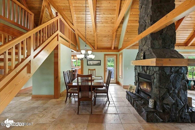 33405 Keystone Dr, Soldotna, AK 99669 - dining space with stone tile floors, a wood ceiling with exposed beams, a chandelier, stairs, and a fireplace