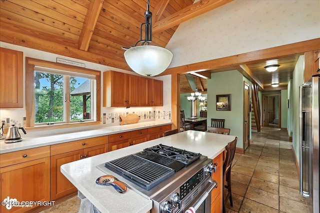 33405 Keystone Dr, Soldotna, AK 99669 - kitchen with wood ceiling, appliances with stainless steel finishes, a chandelier, light countertops, and brown cabinets
