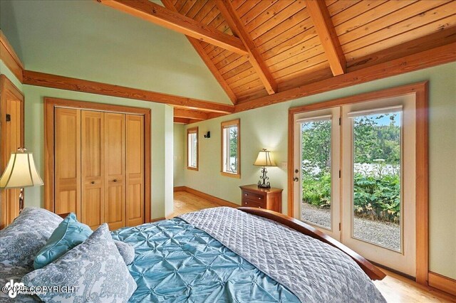 33405 Keystone Dr, Soldotna, AK 99669 - bedroom featuring access to exterior, light wood finished floors, a closet, and wood ceiling