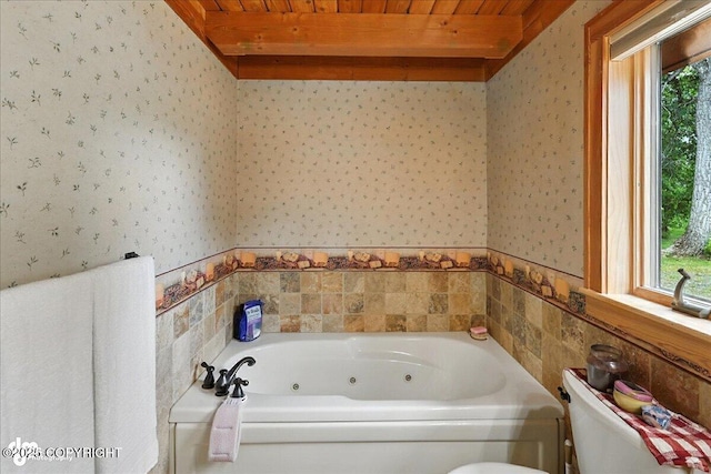 33405 Keystone Dr, Soldotna, AK 99669 - full bath featuring wallpapered walls, plenty of natural light, a whirlpool tub, and a wood ceiling with exposed beams
