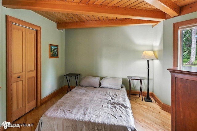 33405 Keystone Dr, Soldotna, AK 99669 - bedroom with light wood-style floors and a wooden ceiling with exposed beams