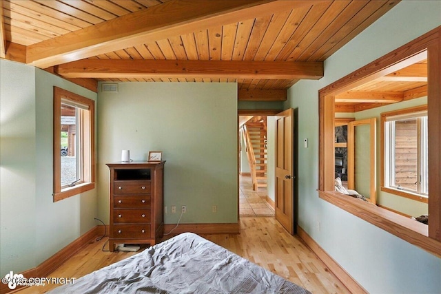 33405 Keystone Dr, Soldotna, AK 99669 - bedroom with light wood-style flooring and a wood ceiling with exposed beams