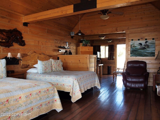 bedroom with vaulted ceiling with beams, wood walls, dark hardwood / wood-style flooring, and wood ceiling