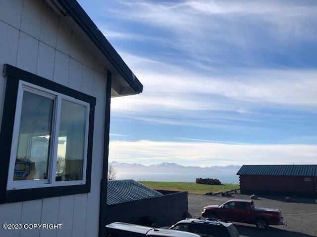 view of side of home featuring a mountain view