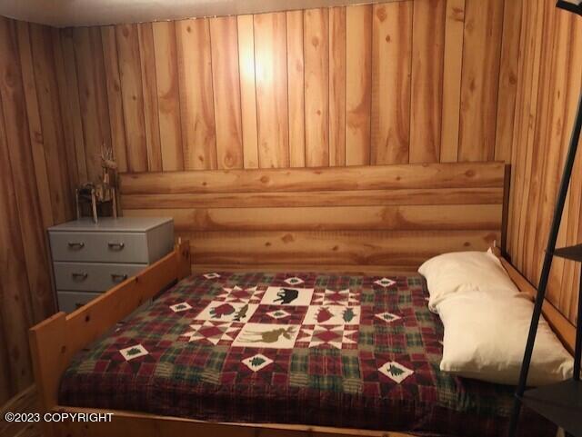 bedroom with rustic walls