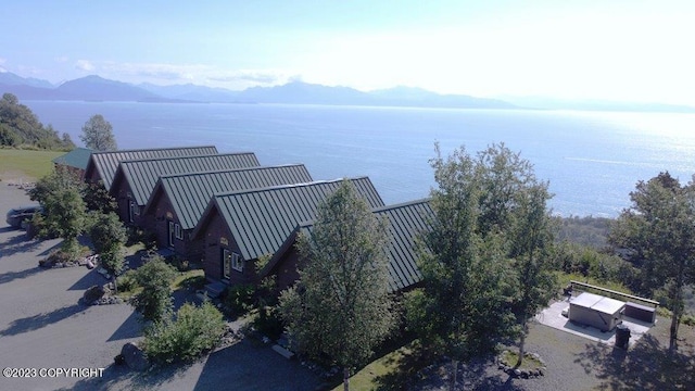 aerial view featuring a water and mountain view