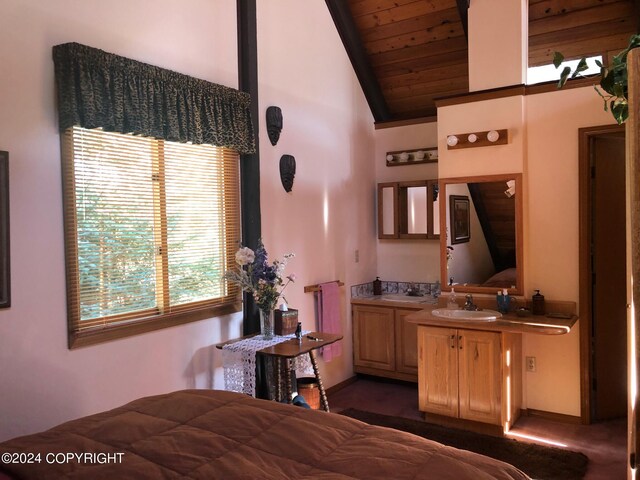 bedroom featuring wood ceiling, high vaulted ceiling, and sink