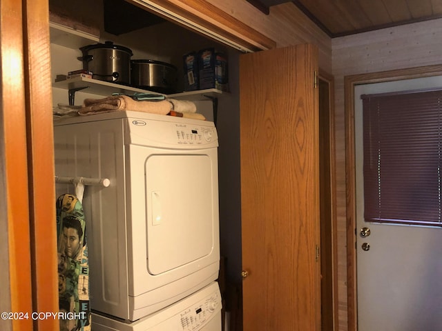 laundry room with stacked washer and clothes dryer