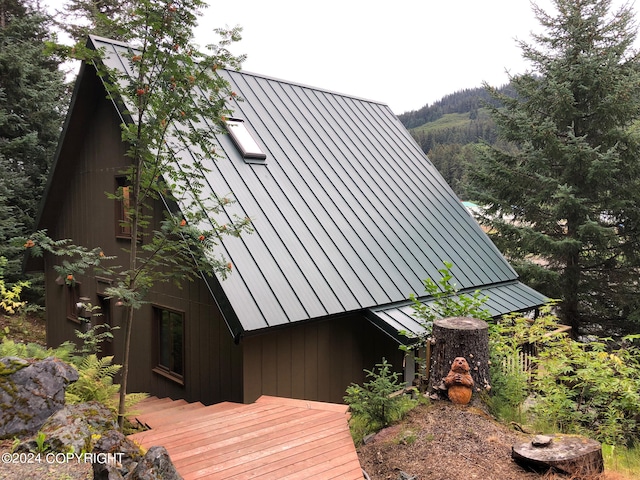 view of side of home featuring a deck