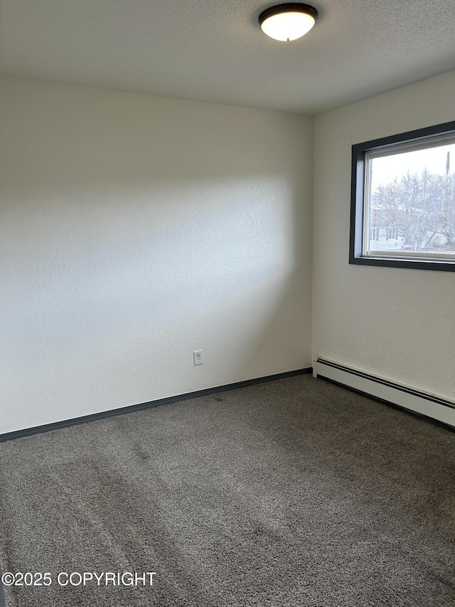 3940 E 9th Ave, Anchorage, AK 99508 - carpeted empty room with baseboard heating