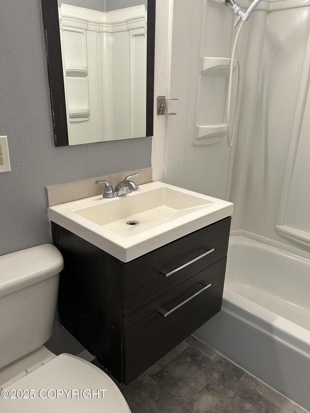 3940 E 9th Ave, Anchorage, AK 99508 - full bathroom featuring vanity, shower / tub combination, and toilet