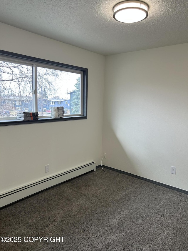 3940 E 9th Ave, Anchorage, AK 99508 - unfurnished room featuring a baseboard radiator, a textured ceiling, carpet flooring, and baseboards
