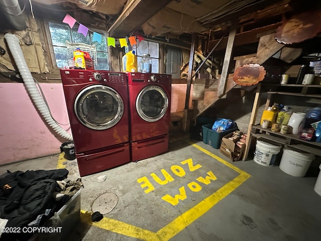 laundry room with washing machine and clothes dryer