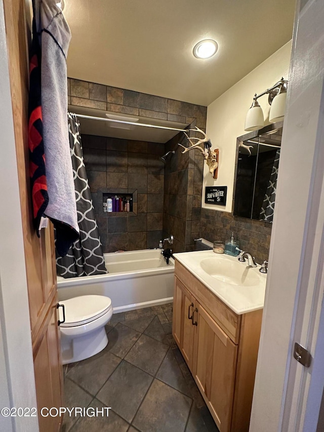 full bathroom with toilet, shower / tub combo with curtain, vanity, and tile flooring