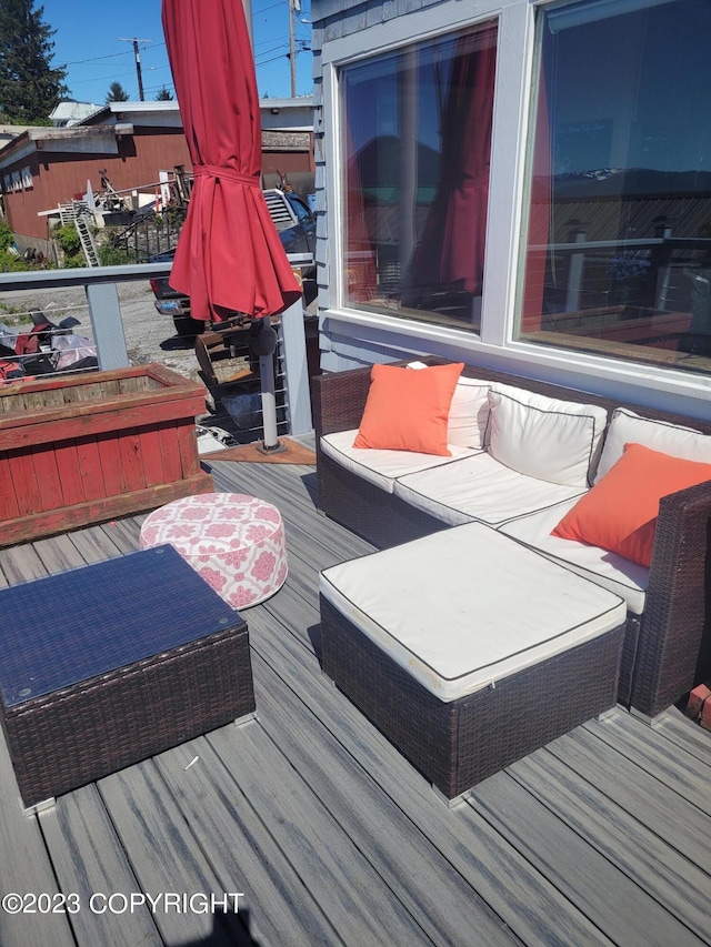 wooden deck with an outdoor hangout area