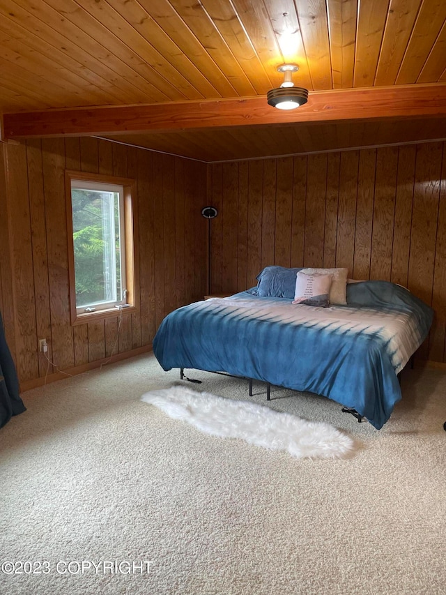 carpeted bedroom featuring wood walls, wooden ceiling, and beamed ceiling