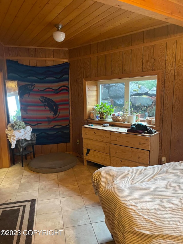 tiled bedroom with wooden ceiling, wood walls, and multiple windows