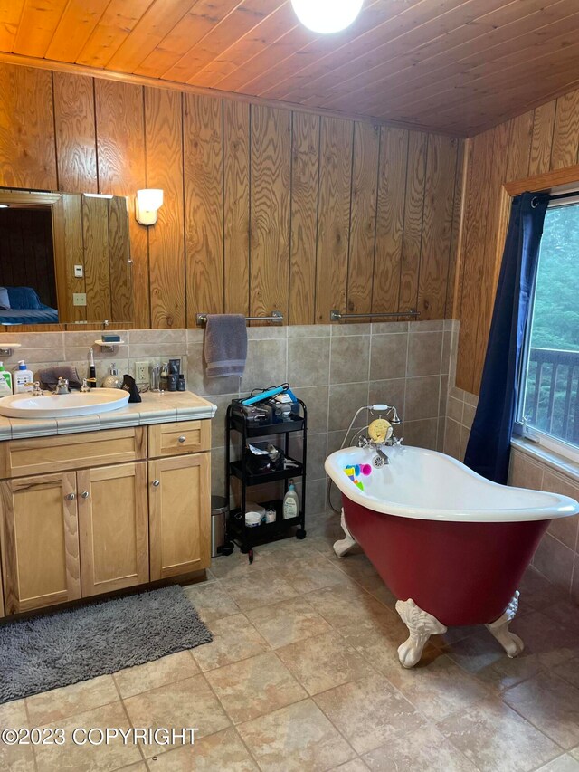 bathroom featuring tile flooring, wood walls, and wooden ceiling