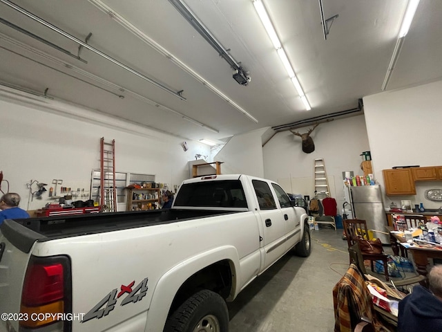 garage featuring stainless steel refrigerator