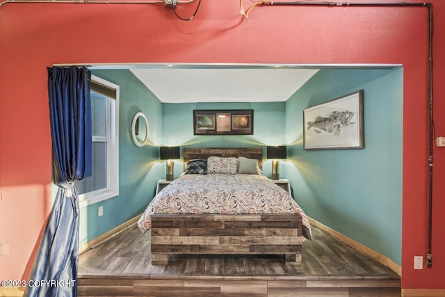 bedroom featuring dark hardwood / wood-style flooring