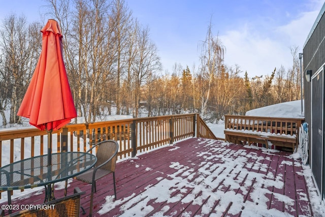 view of snow covered deck