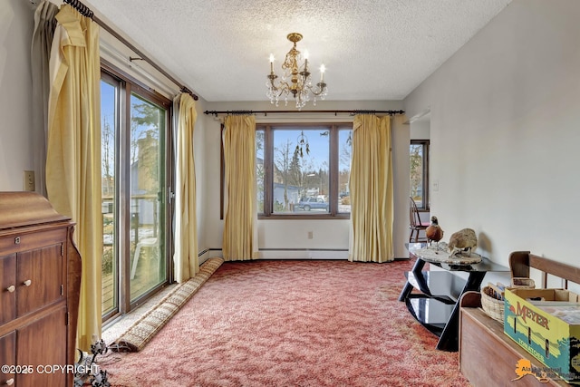 interior space with carpet floors, a healthy amount of sunlight, a baseboard heating unit, and a notable chandelier