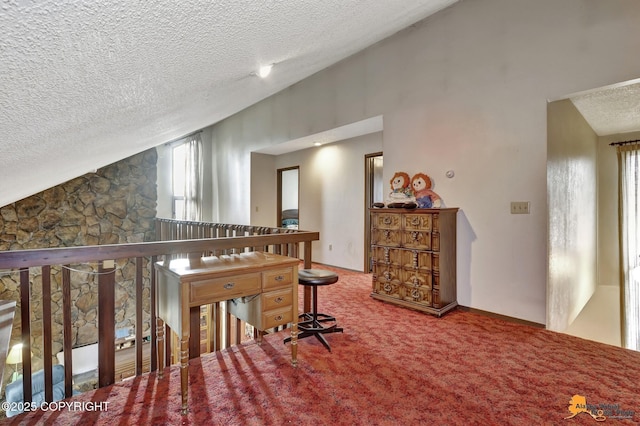 interior space with carpet floors, vaulted ceiling, a textured ceiling, and an upstairs landing