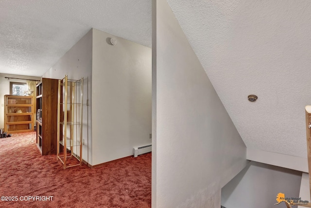 interior space featuring a baseboard radiator, carpet flooring, and a textured ceiling