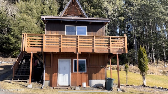 rear view of property with a yard