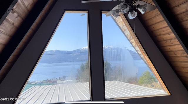 interior details featuring ceiling fan and a mountain view