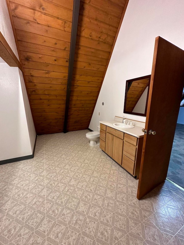 interior space featuring lofted ceiling, sink, wood ceiling, and light tile floors