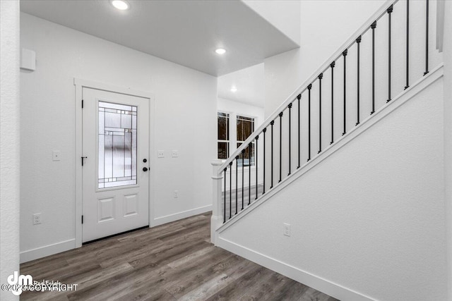 entrance foyer with dark hardwood / wood-style floors