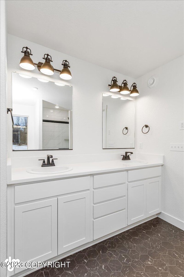 bathroom featuring tile floors, large vanity, and double sink