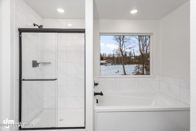 full bath featuring recessed lighting, a garden tub, and a stall shower