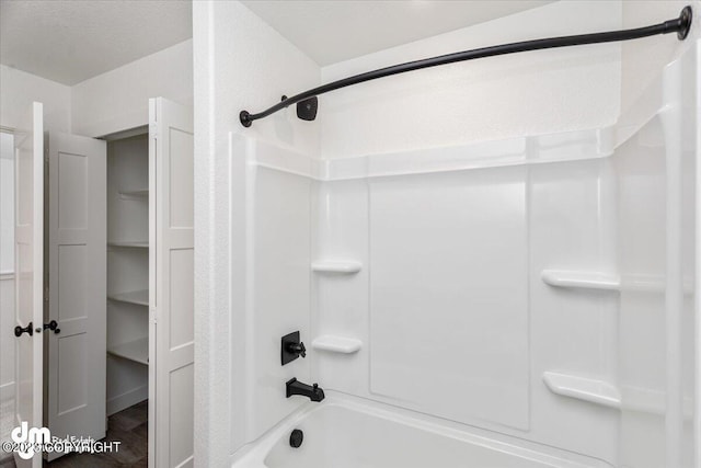 bathroom featuring washtub / shower combination