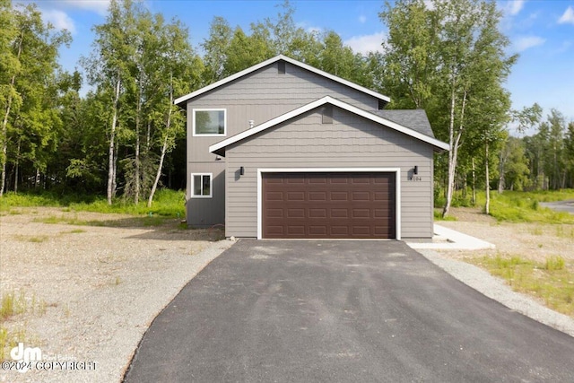 view of front of house with aphalt driveway