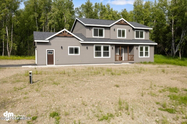 view of front of house with roof with shingles