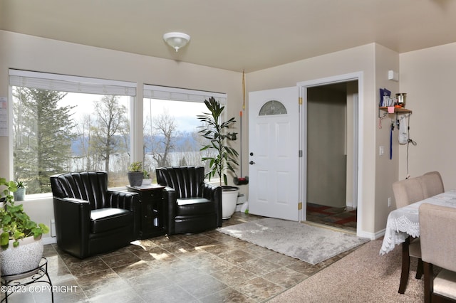 living area featuring plenty of natural light and tile floors