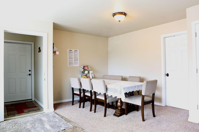 view of carpeted dining area